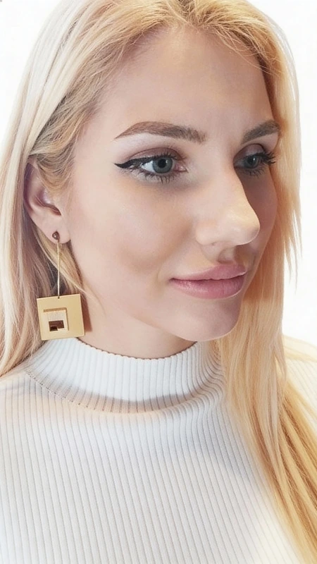 These striking geometric dangle earrings showcase the perfect harmony between natural wood and polished brass accents. Each earring features beautifully crafted square elements in warm, natural wood tones that create an eye-catching layered silhouette, suspended from elegant brass hoops for effortless movement and sophisticated appeal.
The geometric design celebrates modern minimalism while honoring traditional Greek craftsmanship. The smooth wood squares are precisely cut and finished to highlight the natural grain patterns, creating unique variations that make each pair truly one-of-a-kind. The warm brass components add a luxurious golden accent that beautifully complements the organic wood tones.
These versatile statement earrings transition seamlessly from casual daywear to evening elegance. Pair them with flowing fabrics and earth tones for a bohemian-inspired look, or contrast them against sleek contemporary outfits for an artistic touch. The lightweight construction ensures comfortable all-day wear despite their dramatic presence.
Handcrafted by Greek designer Aikaterini Chalkiadaki, these earrings represent the perfect fusion of natural materials and contemporary design. The substantial length creates beautiful movement while the geometric squares add architectural interest to any ensemble. Whether you're attending a gallery opening or enjoying weekend brunch, these earrings make an unforgettable style statement.
Care Instructions: Gently clean with a soft, dry cloth. Avoid exposure to water, perfumes, and harsh chemicals. Store in a dry place to preserve the natural wood finish and brass luster.