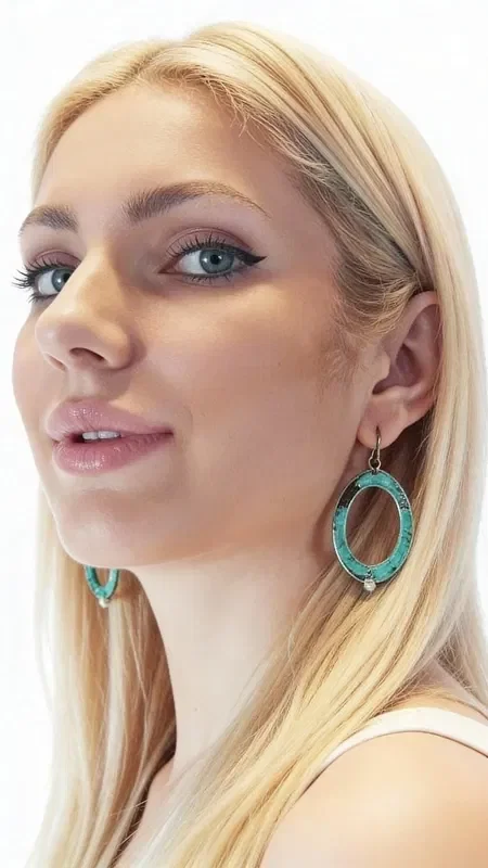 These striking dangle hoop earrings with pearls combine the uniqueness of Greek craftsmanship with the natural beauty of pearls. Each piece is designed by Greek Jewelry Designer Aikaterini Chalkiadaki, offering a modern take on traditional handmade jewelry.

The exceptional green patina on the copper creates a vintage feel that flatters every skin tone, while the natural pearls add elegance and femininity. The oval shape of the hoops is carefully designed to flatter the face, creating a striking look for any occasion.

These modern earrings are ideal for both everyday wear and special moments, allowing you to complete your look with style and authenticity. Store in a dry place and clean gently with a soft cloth to preserve the shine of the pearls and the patina of the copper.