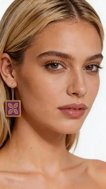 Embroidered statement earrings that combine the traditional art of embroidery with a modern geometric design. These striking earrings in a bold burgundy color, designed by Greek Jewelry Designer Aikaterini Chalkiadaki, offer a unique aesthetic that stands out. The gold thread creates intricate geometric patterns that highlight the folklore design, while the square shape adds a modern touch of elegance. Each embroidery is handmade with special attention to detail, creating a piece of jewelry that combines art and style. The burgundy hue is ideal for adding color and character to any look. These earrings are perfect for special occasions, from evening outings to wedding events, as well as for elevating your everyday style. They pair perfectly with monochrome outfits and add a striking ethnic character.

Material: Brass, Fabric
Care: Store in a dry place and avoid contact with moisture to preserve the shine of the gold thread.