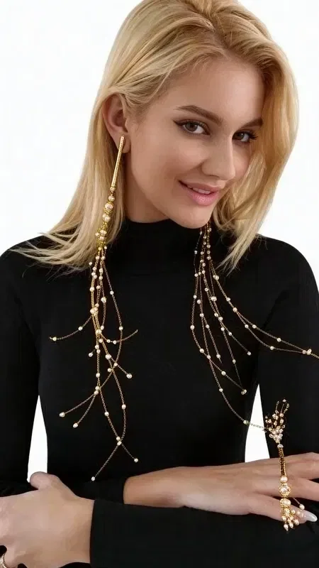 The statement long earrings with pearls are the perfect piece of jewelry to steal the spotlight in every look. Designed by Greek Jewelry Designer Aikaterini Chalkiadaki, these handmade earrings combine the classic elegance of butterflies with a contemporary aesthetic.

Each earring features chains that flow elegantly from the ear, creating an impressive movement enhanced by white pearls strategically placed along the chains. Their statement design makes them ideal for weddings, evening outings, and special occasions.

The handmade construction guarantees the quality and uniqueness of each piece, while the gold hue adds a luxe aesthetic that pairs easily with any outfit.

Maintain your earrings by storing them in a dry place and cleaning them with a soft cloth after each use.